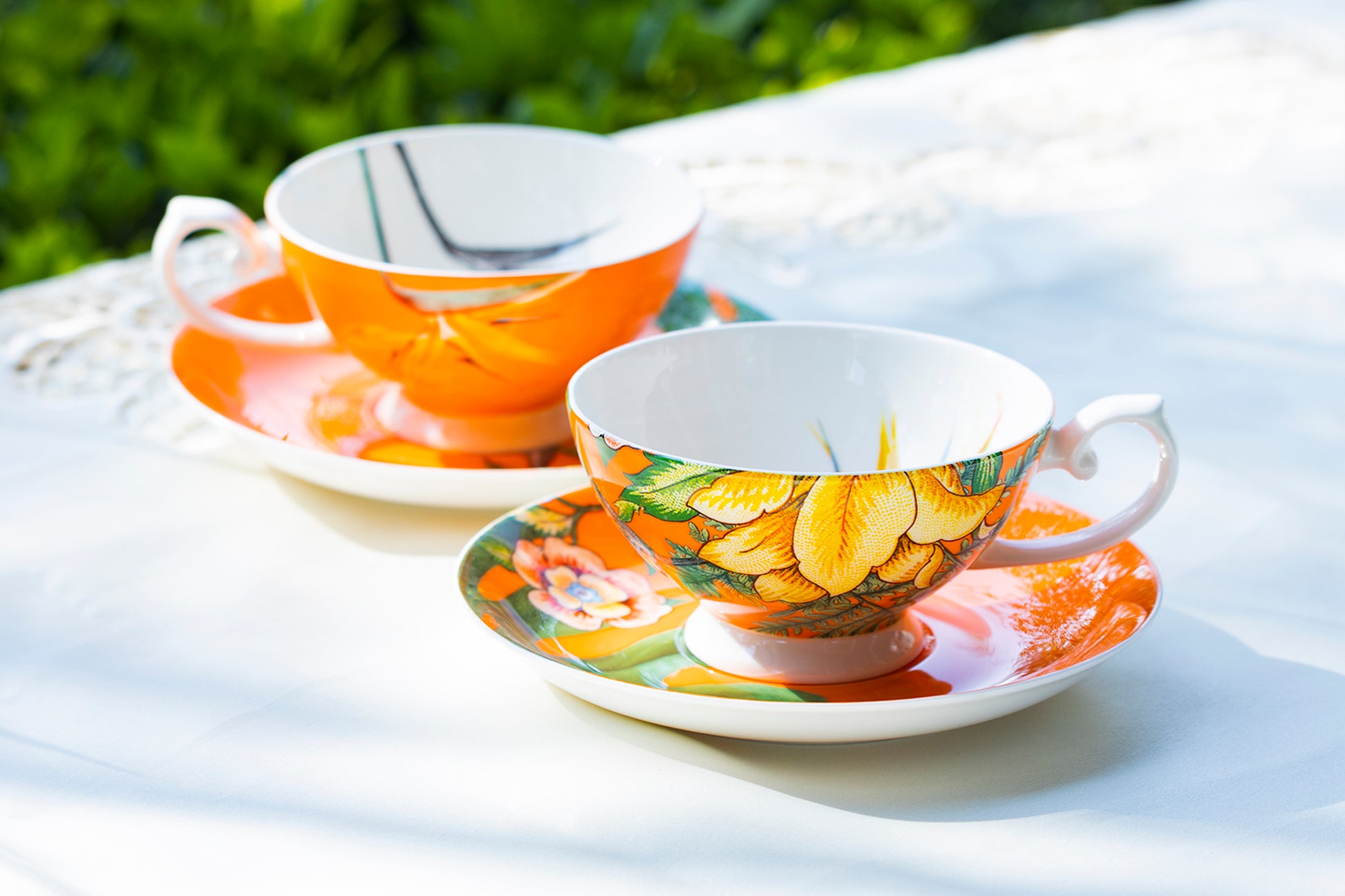 orange tea cup and saucer