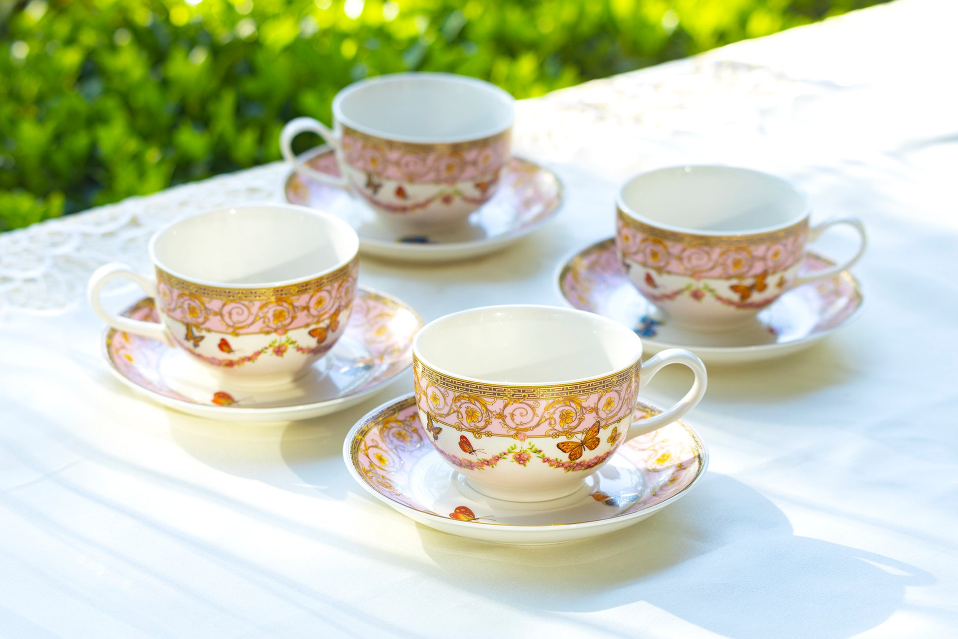 set of four cup and saucer floral butterfly pink